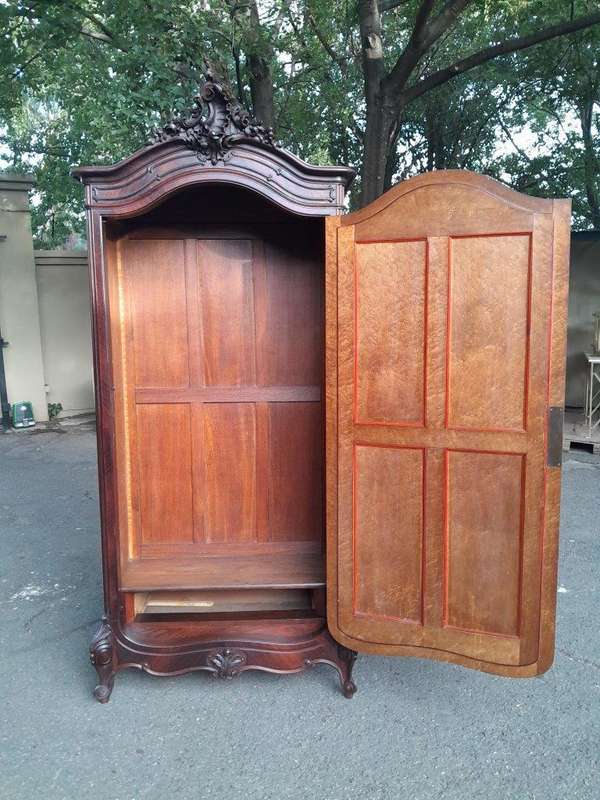An Early 20th Century French Carved Rosewood Armoire with Bevelled Mirror and Lock and Key
