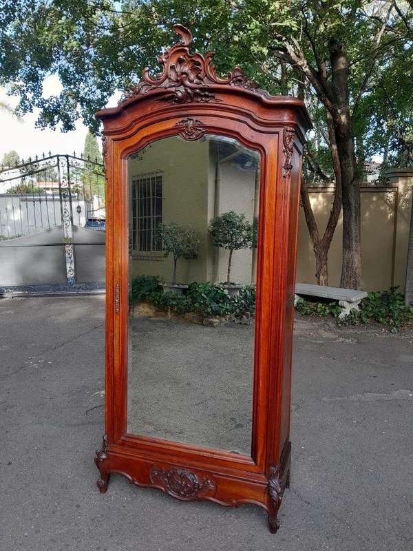 A 20TH Century Circa 1900s French Carved Mahogany Armoire with Bevelled Mirror and Five Shelves