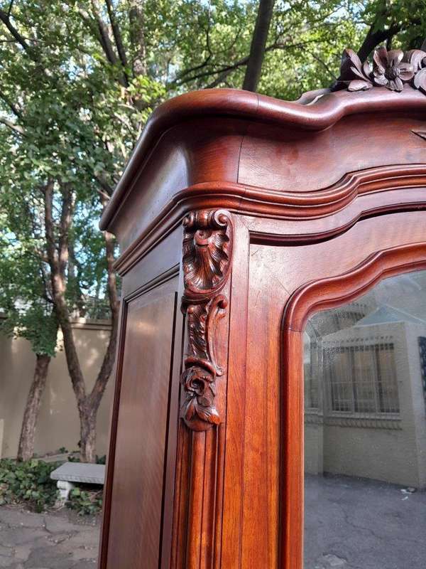 A 20TH Century Circa 1900s French Carved Mahogany Armoire with Bevelled Mirror and Five Shelves