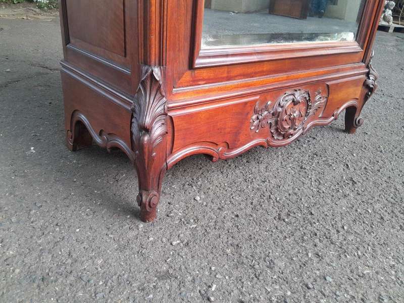 A 20TH Century Circa 1900s French Carved Mahogany Armoire with Bevelled Mirror and Five Shelves