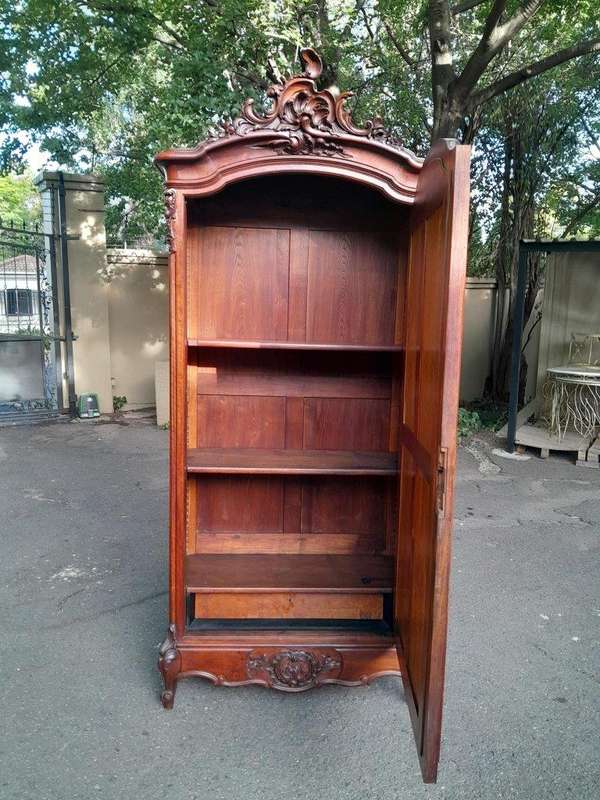 A 20TH Century Circa 1900s French Carved Mahogany Armoire with Bevelled Mirror and Five Shelves