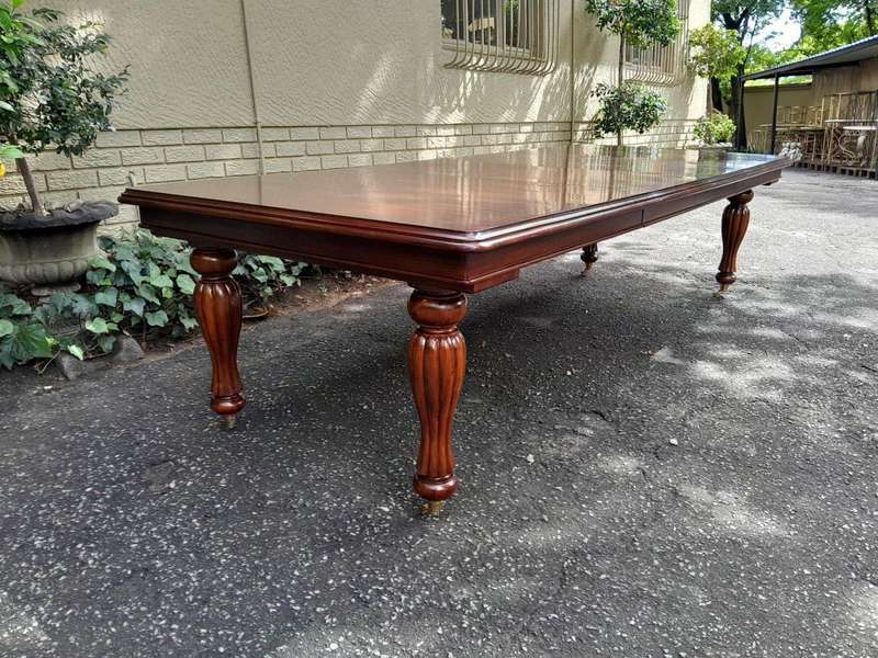 A 20Th Century Mahogany Extending Table with Two Extensions, on Brass Castors with Crank Handle