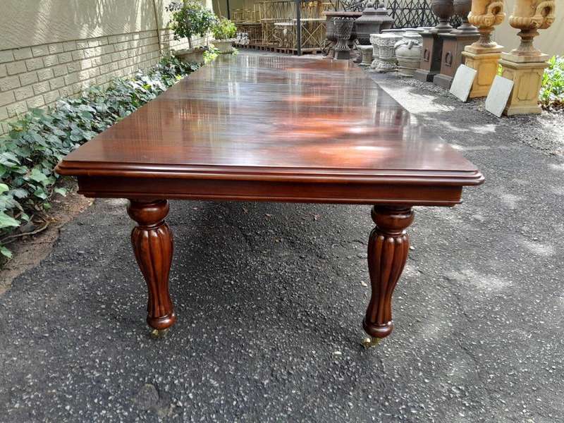 A 20Th Century Mahogany Extending Table with Two Extensions, on Brass Castors with Crank Handle
