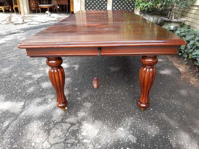 A 20Th Century Mahogany Extending Table with Two Extensions, on Brass Castors with Crank Handle