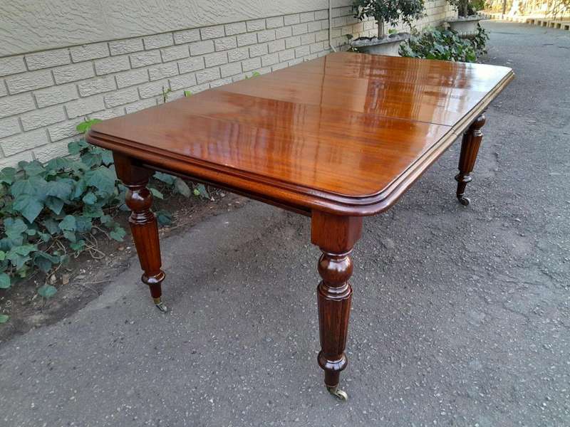 A 20th Century Victorian Style Mahogany Extending Dining Table Seats 8 on Brass Castors