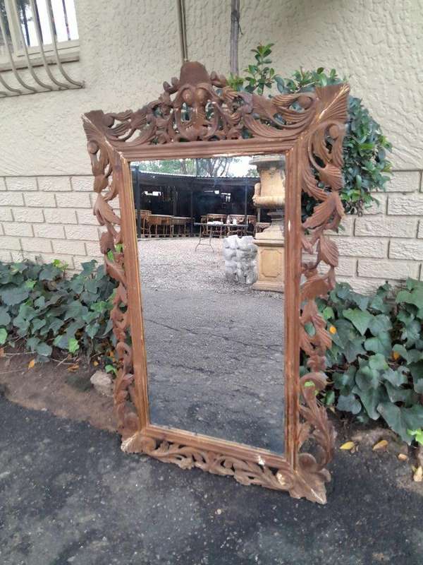 An Ornately Carved And Bleached To A Contemporary Finish Wooden Mirror