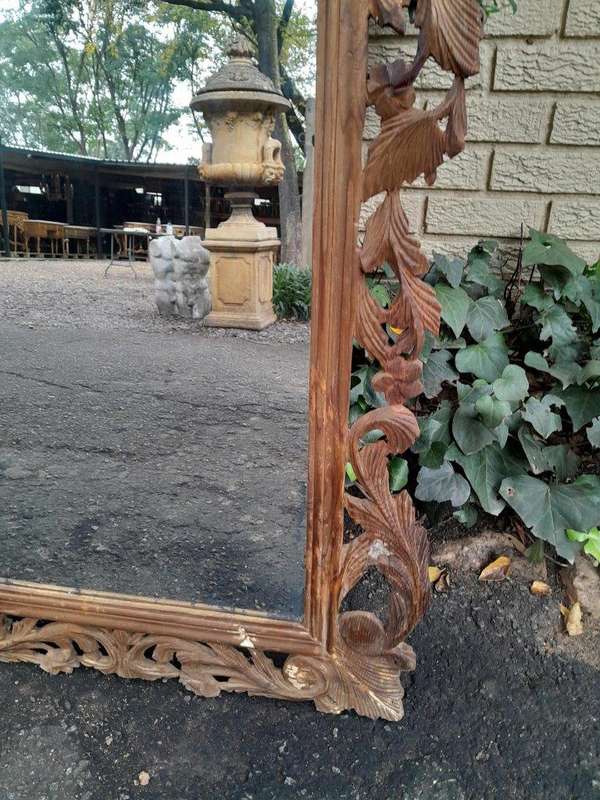 An Ornately Carved And Bleached To A Contemporary Finish Wooden Mirror