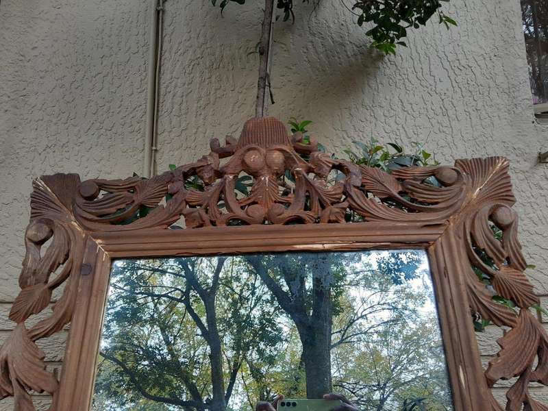 An Ornately Carved And Bleached To A Contemporary Finish Wooden Mirror