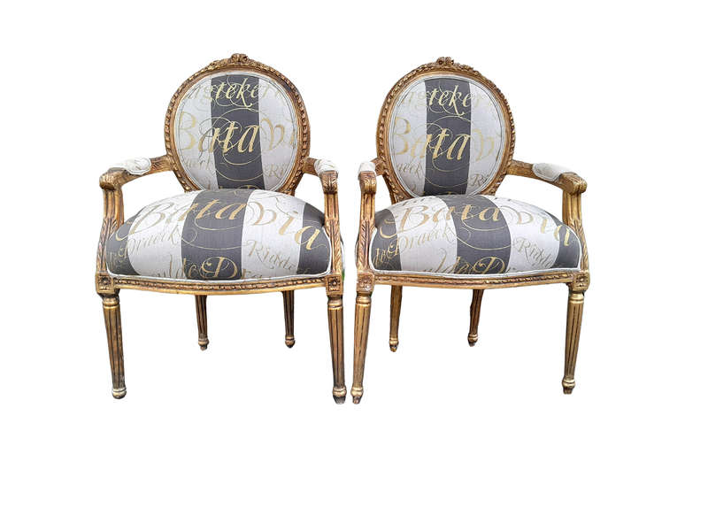 A Pair of French Style Carved and Gilded Armchairs Upholstered in a Custom-Made Hand Printed Fabr...