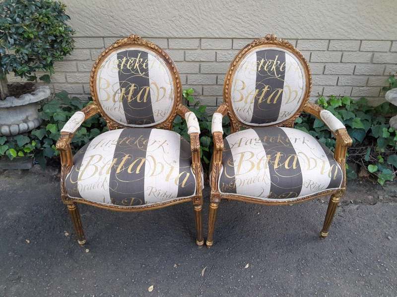 A Pair of French Style Carved and Gilded Armchairs Upholstered in a Custom-Made Hand Printed Fabr...