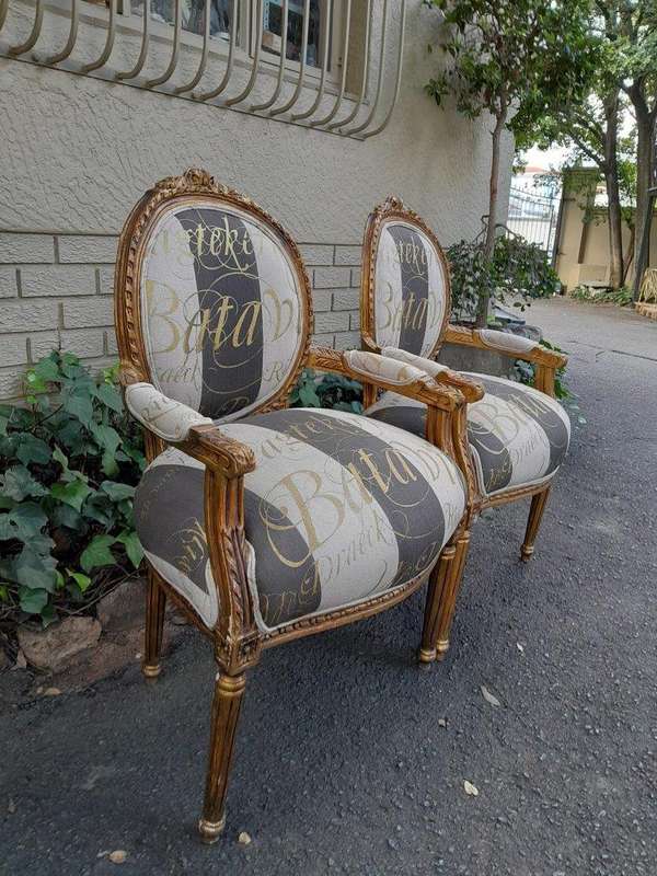 A Pair of French Style Carved and Gilded Armchairs Upholstered in a Custom-Made Hand Printed Fabr...