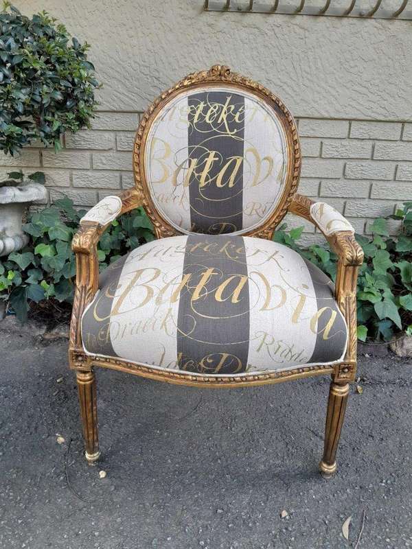 A Pair of French Style Carved and Gilded Armchairs Upholstered in a Custom-Made Hand Printed Fabr...