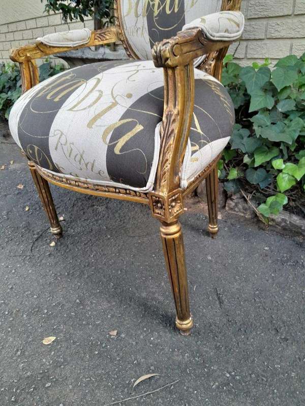 A Pair of French Style Carved and Gilded Armchairs Upholstered in a Custom-Made Hand Printed Fabr...