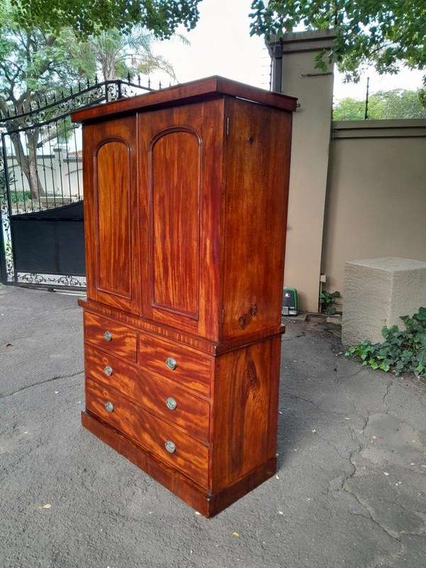 A 20th Century Flame Mahogany Linen Press