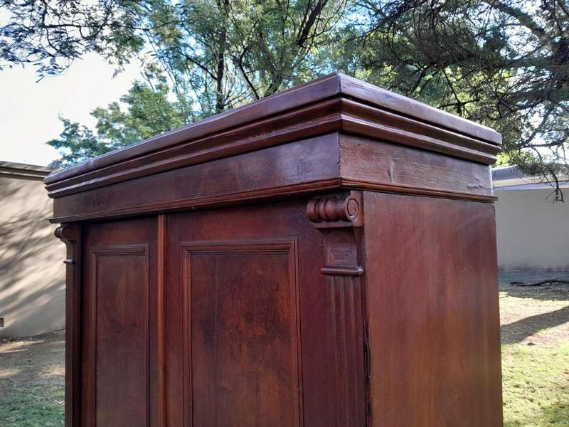 A Mid  20th Century Stinkwood Linen Press with Four Original Shelves and Drawers