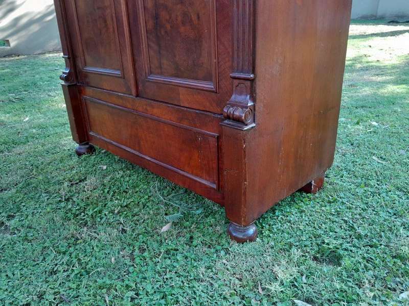 A Mid  20th Century Stinkwood Linen Press with Four Original Shelves and Drawers
