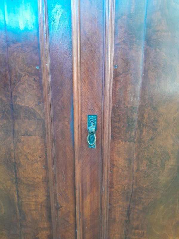 A Mid  20th Century Stinkwood Linen Press with Four Original Shelves and Drawers