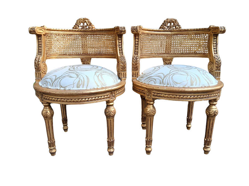 A Pair Of French Louis XVI Style Carved And Hand Gilded  Rattan Chairs Upholstered In A Custom M...