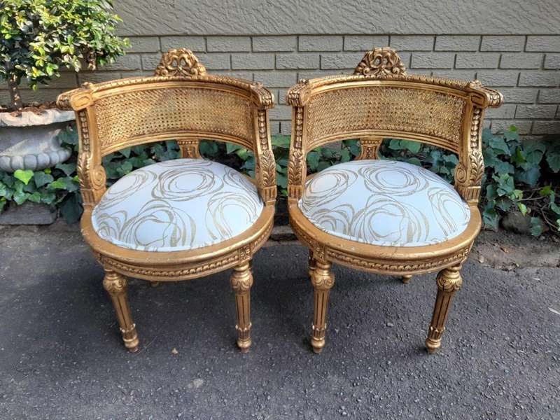 A Pair Of French Louis XVI Style Carved And Hand Gilded  Rattan Chairs Upholstered In A Custom M...