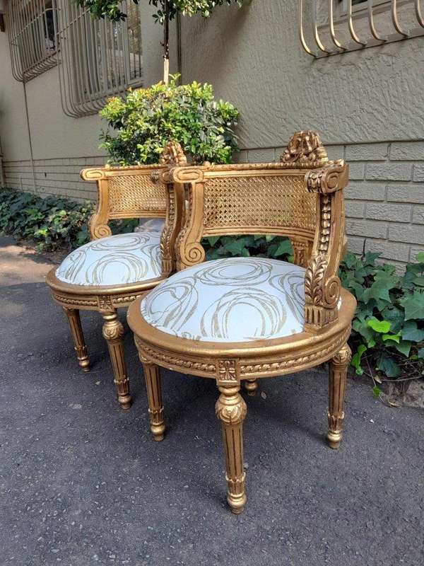 A Pair Of French Louis XVI Style Carved And Hand Gilded  Rattan Chairs Upholstered In A Custom M...