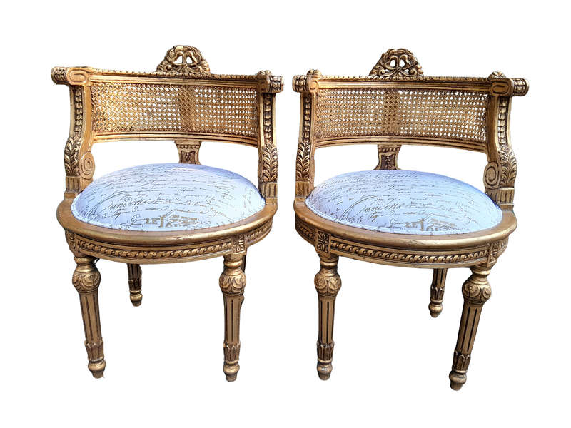 A Pair Of French Louis XVI Style Carved And Hand Gilded  Rattan Chairs Upholstered In A Custom M...