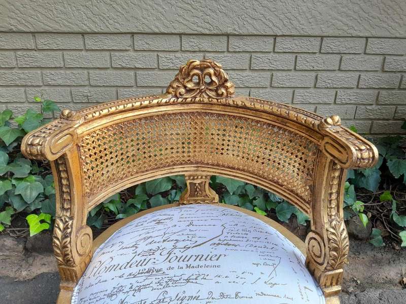A Pair Of French Louis XVI Style Carved And Hand Gilded  Rattan Chairs Upholstered In A Custom M...
