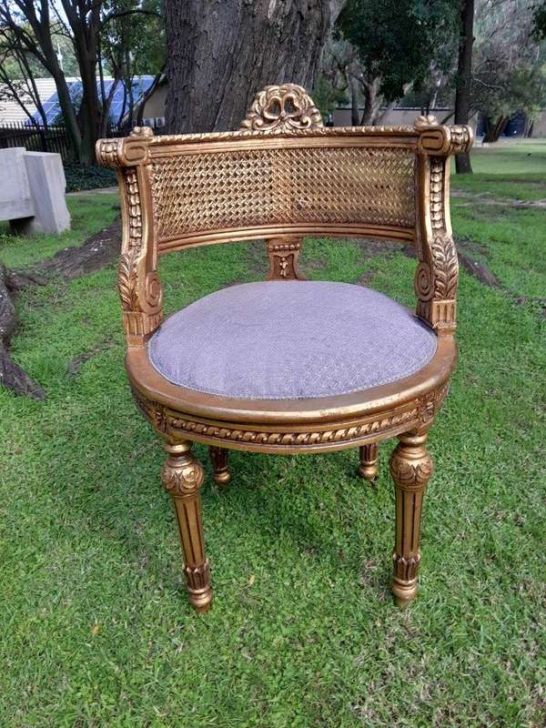 A Pair of French Louis XVI Style Carved and Rattan Chairs