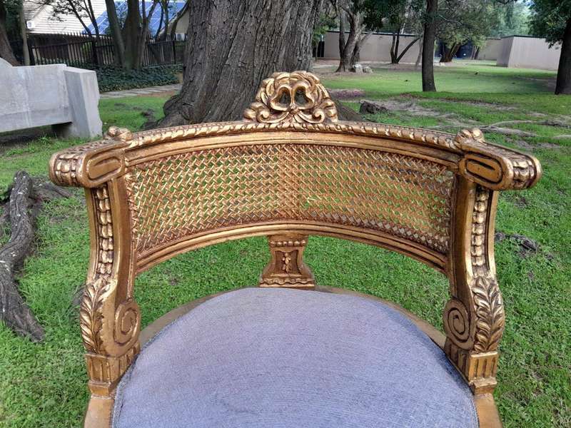 A Pair of French Louis XVI Style Carved and Rattan Chairs