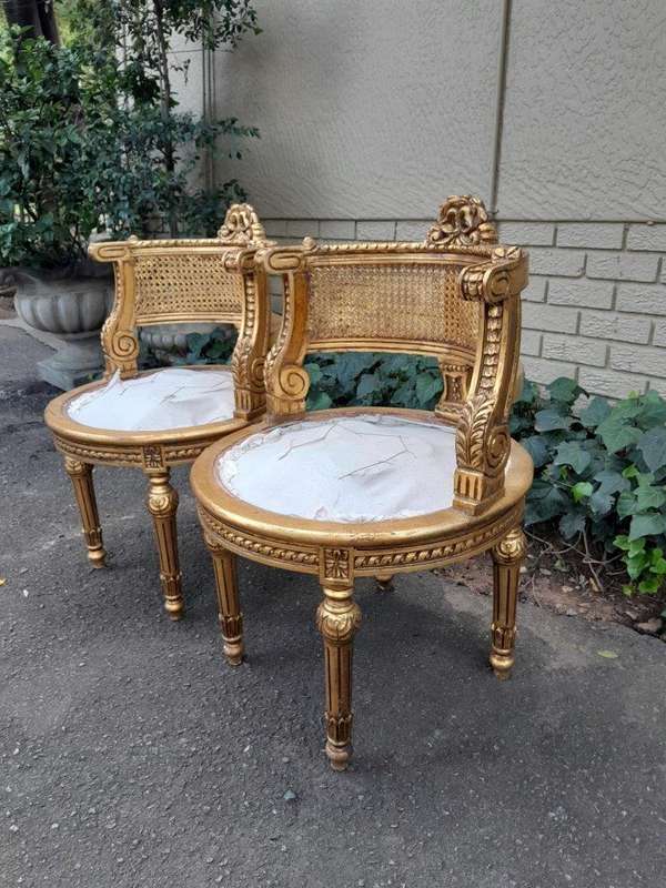A Pair of French Louis XVI Style Carved and Rattan Chairs