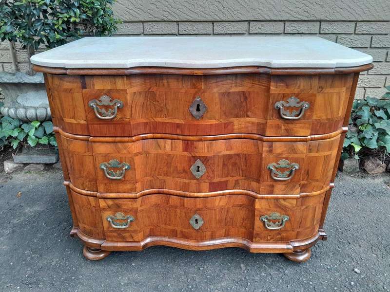 An Antique 19th Century Walnut Bombe Chest of Drawers With Brass Hardware