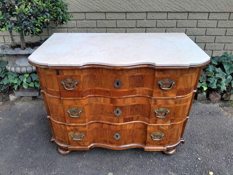 An Antique 19th Century Walnut Bombe Chest of Drawers With Brass Hardware