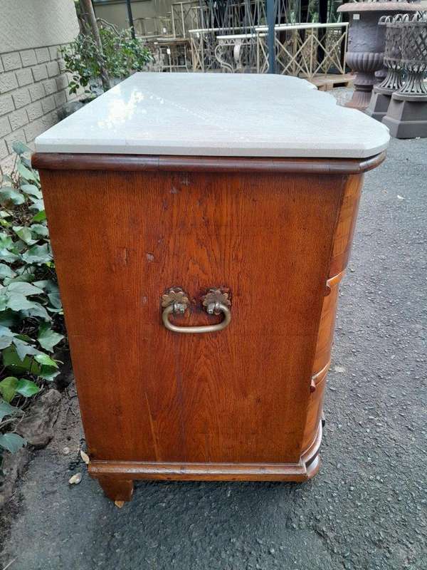 An Antique 19th Century Walnut Bombe Chest of Drawers With Brass Hardware