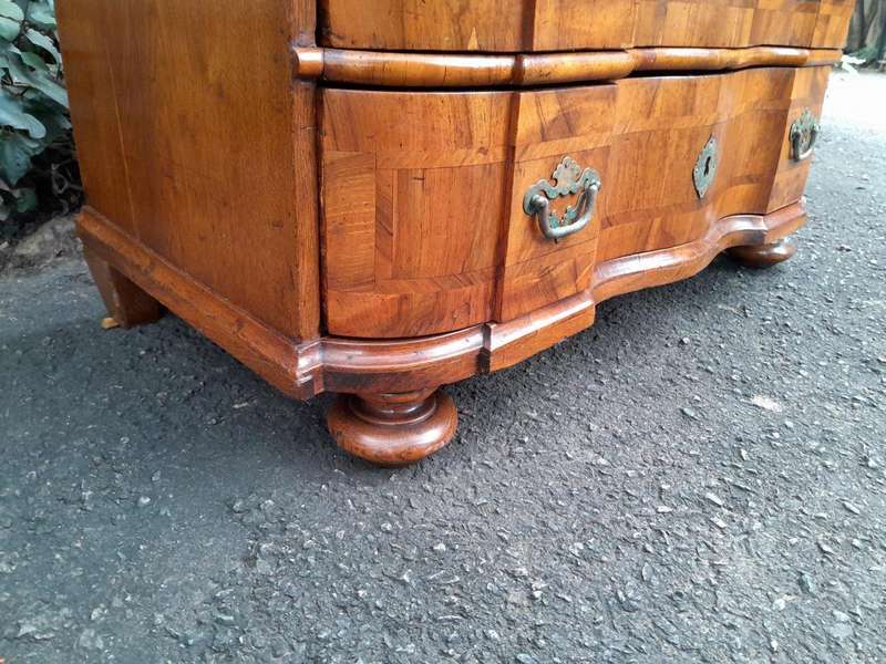 An Antique 19th Century Walnut Bombe Chest of Drawers With Brass Hardware
