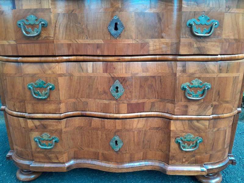 An Antique 19th Century Walnut Bombe Chest of Drawers With Brass Hardware