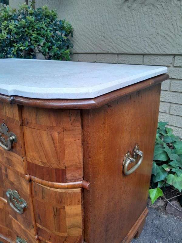 An Antique 19th Century Walnut Bombe Chest of Drawers With Brass Hardware