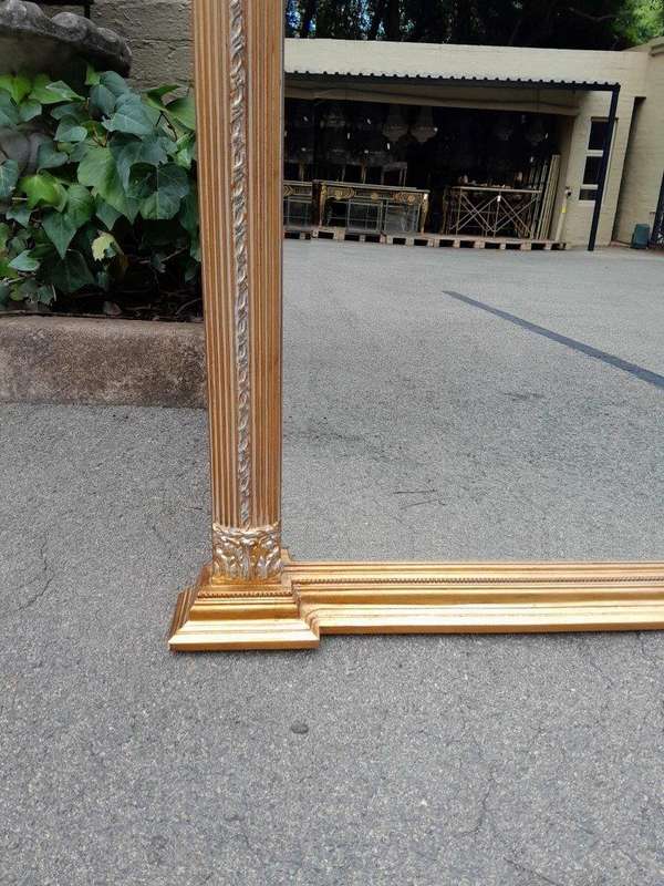 A 20th Century Pair of French Empire Style Giltwood Bevelled Mirrors