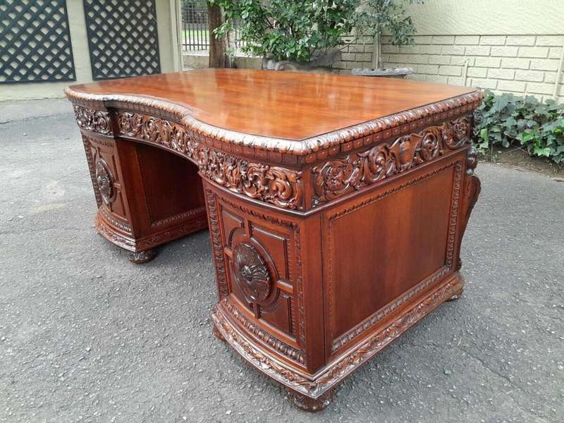 An Exceptional Antique And Rare 19th Century Carved Mahogany Desk