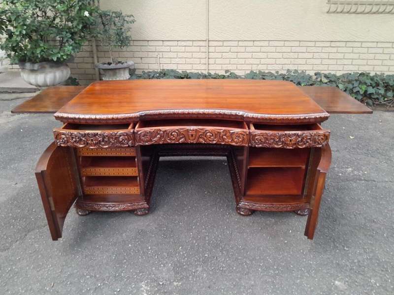 An Exceptional Antique And Rare 19th Century Carved Mahogany Desk