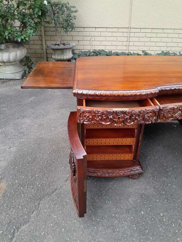 An Exceptional Antique And Rare 19th Century Carved Mahogany Desk