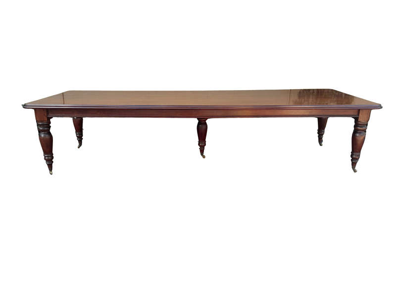 A 20th Century Victorian Style Mahogany Dining Table of Large Proportions on Castors with 5 legs...