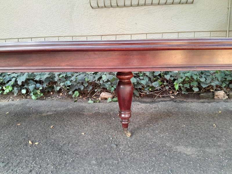 A 20th Century Victorian Style Mahogany Dining Table of Large Proportions on Castors with 5 legs...