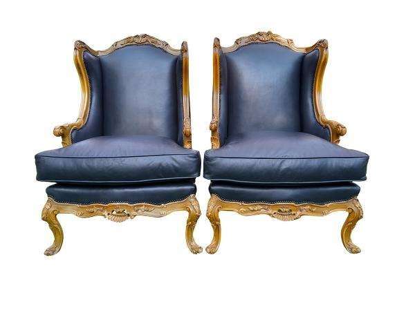 A 20th Century Pair Of French Louis XVI Style Carved Wingback Armchairs