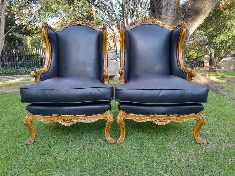 A 20th Century Pair Of French Louis XVI Style Carved Wingback Armchairs