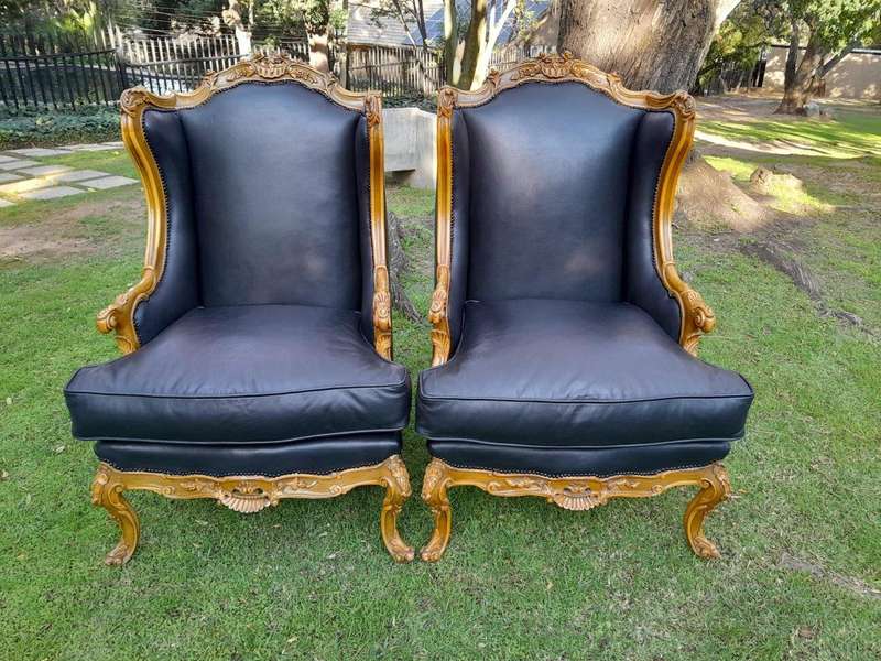 A 20th Century Pair Of French Louis XVI Style Carved Wingback Armchairs