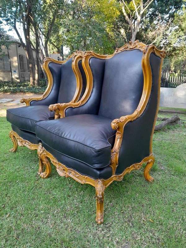 A 20th Century Pair Of French Louis XVI Style Carved Wingback Armchairs
