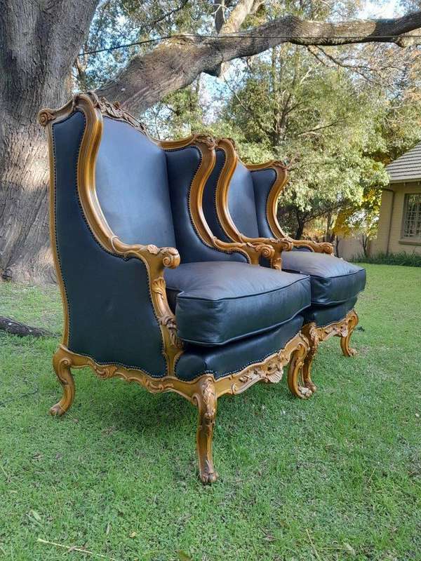 A 20th Century Pair Of French Louis XVI Style Carved Wingback Armchairs