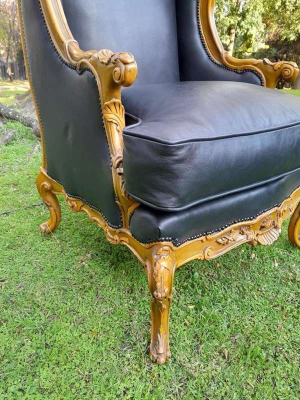 A 20th Century Pair Of French Louis XVI Style Carved Wingback Armchairs