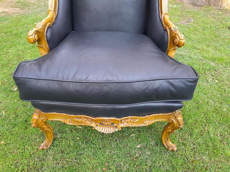 A 20th Century Pair Of French Louis XVI Style Carved Wingback Armchairs