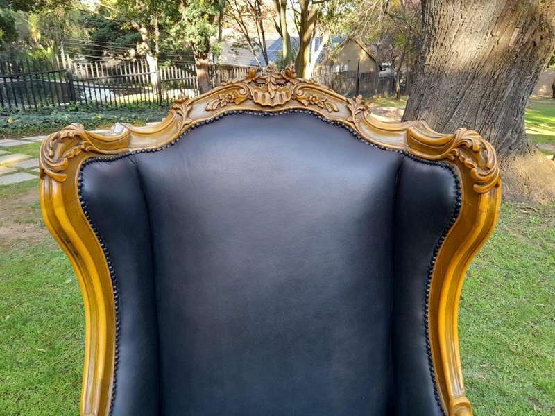 A 20th Century Pair Of French Louis XVI Style Carved Wingback Armchairs
