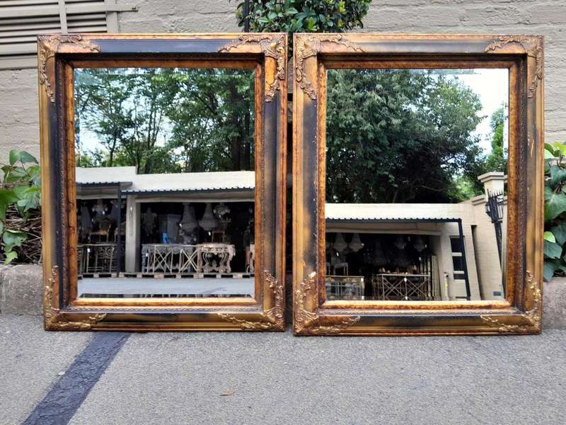 A 20TH Century Pair of Victorian Style Gilt Painted and Walnut Bevelled Mirrors